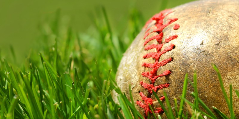 Old baseball glove on the grass